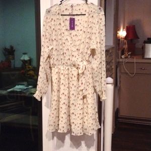 This is a Lascana beige colored dress with flower detail.